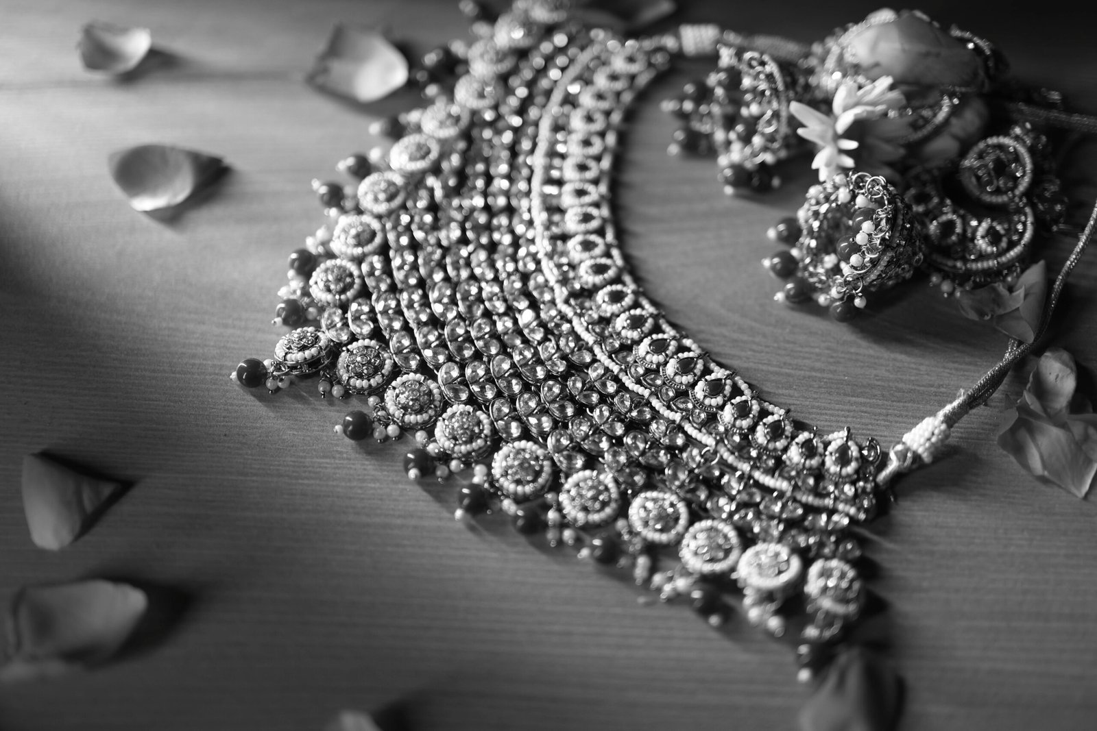 Intricate ethnic necklace with flower petals, beautifully captured in black and white.